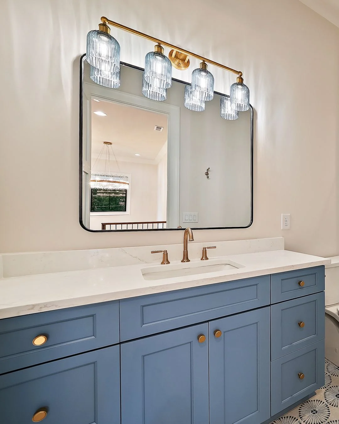 R&B project photo: blue vanity under a brass light fixture