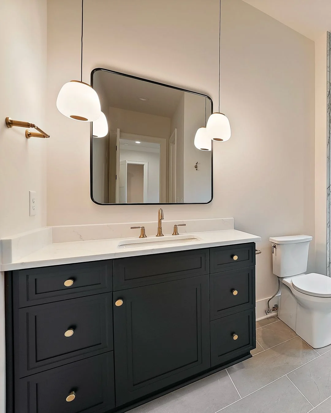 R&B project photo: navy bathroom vanity with tiled wall
