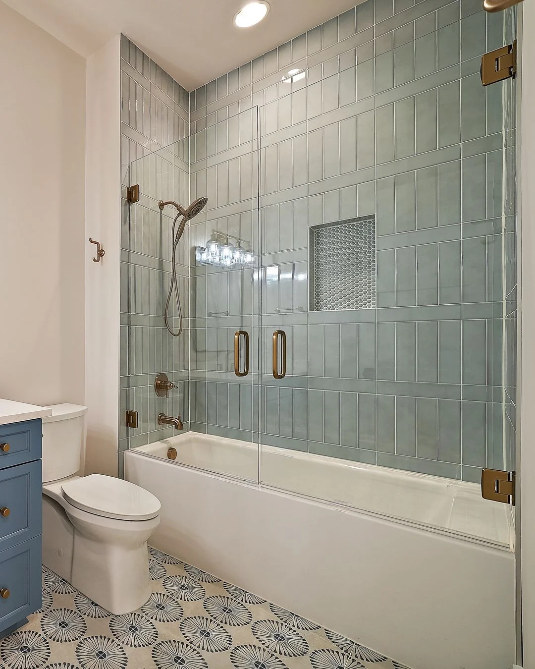 R&B project photo: tub-shower lined with sage green tile