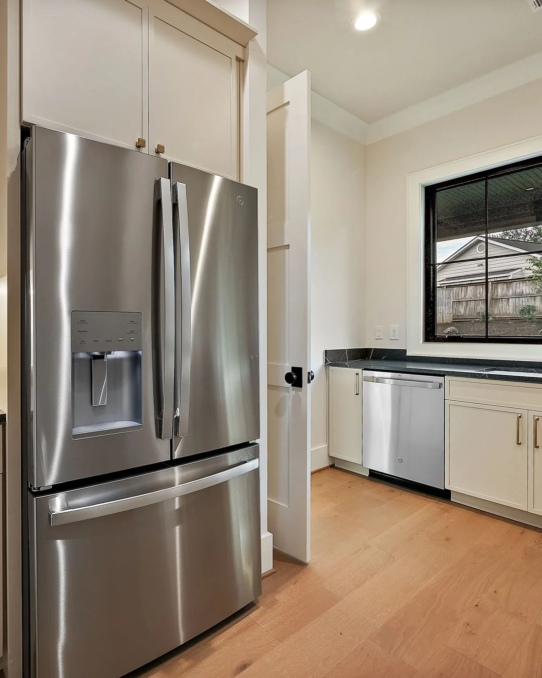 R&B project photo: built-in refrigerator beside pantry cabinets