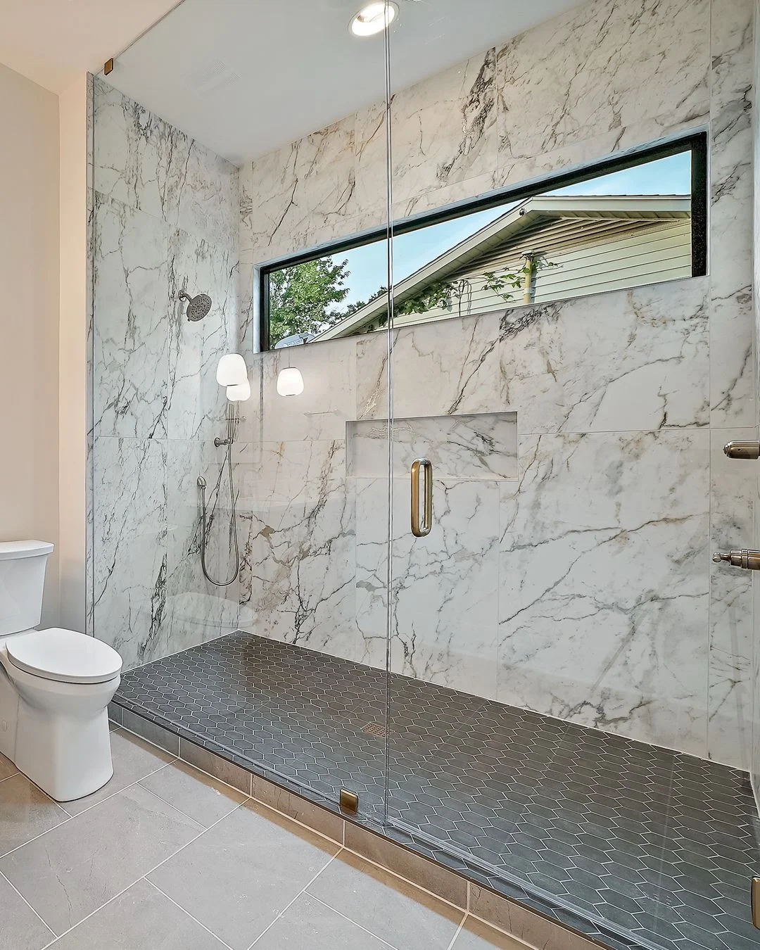 R&B project photo: walk-in shower finished in marble-look tile