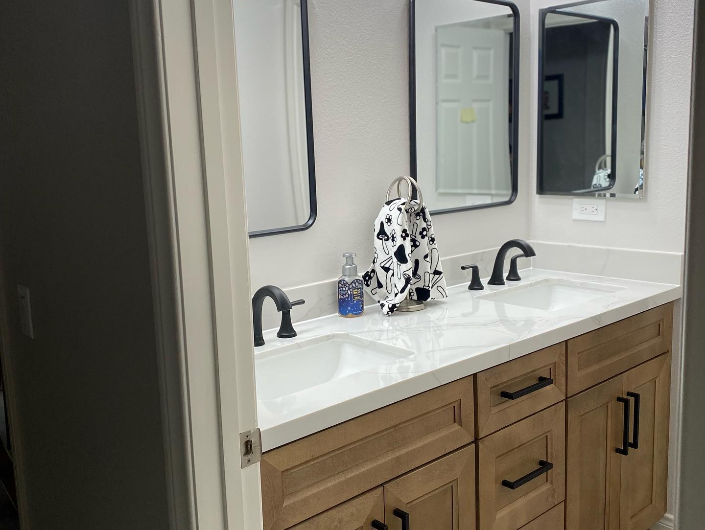 R&B project: wood double vanity with black-framed mirrors