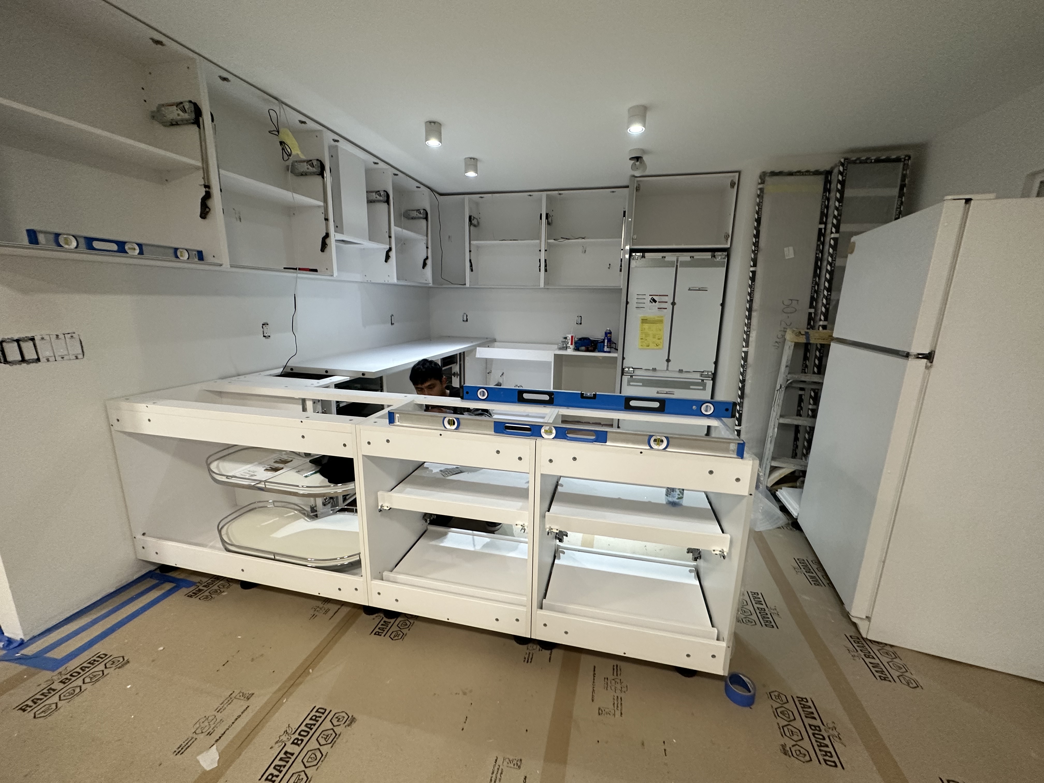 R&B project: kitchen cabinet installation in progress before countertops